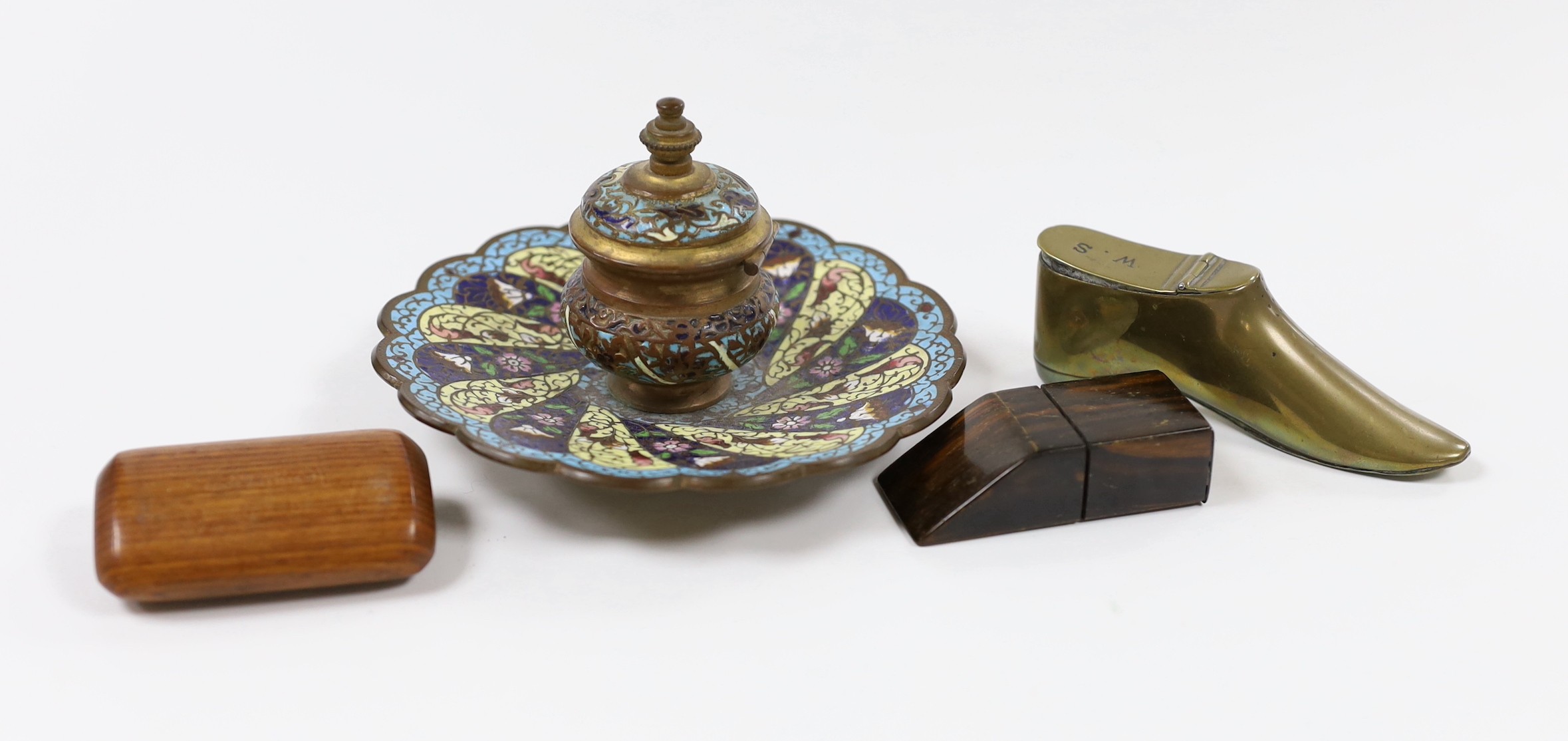 A 19th century French champleve enamel inkstand, 8.5cm tall, a brass snuff boot and two wood snuff boxes